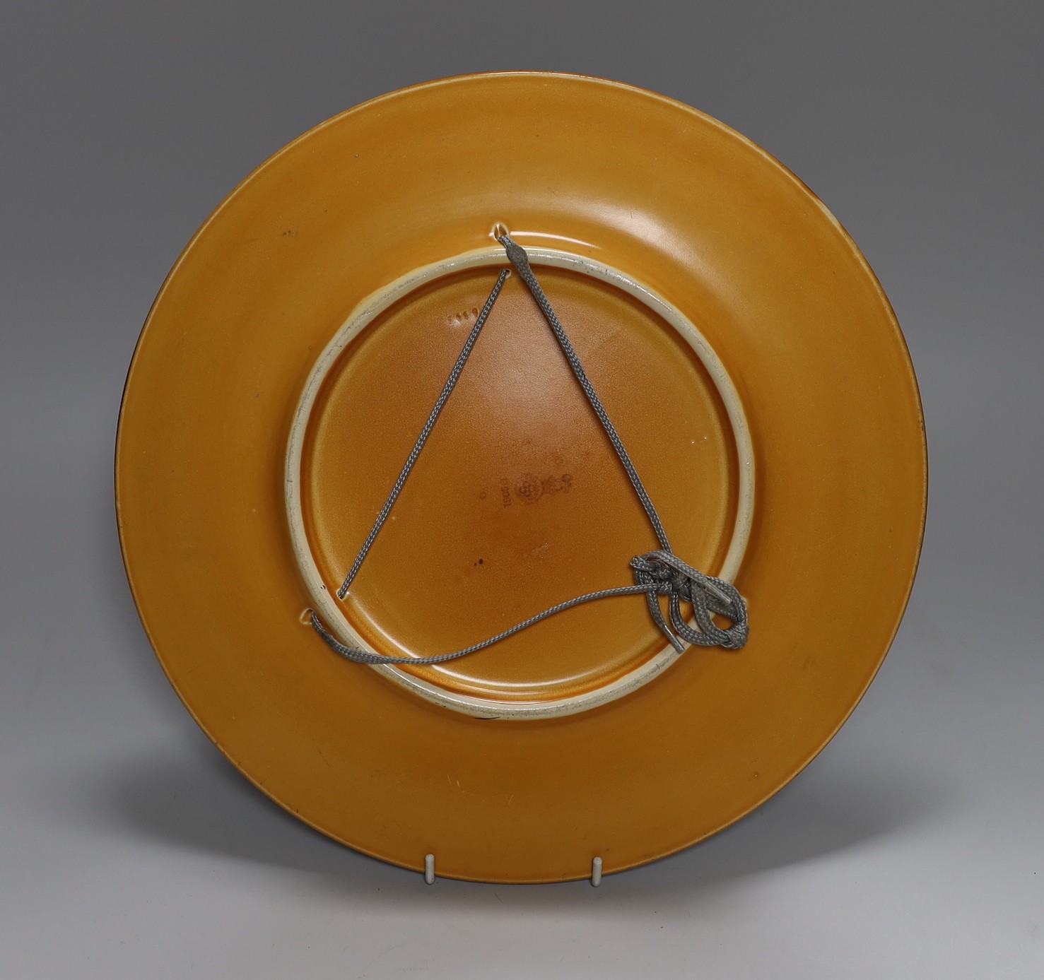 A large Doulton wall plate, model no. D6061 - 34cm diameter And A Dutch Delft drug jar - 26cm tall